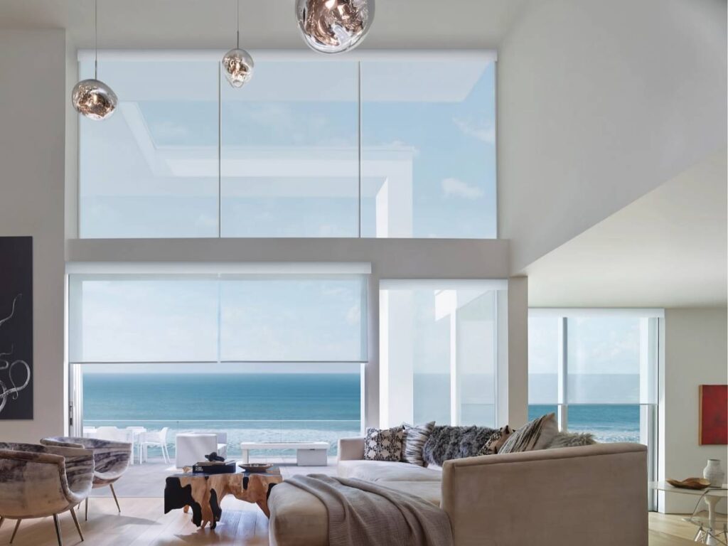 Hunter Douglas Designer Solar Shades on large windows in a residential living room near Kerrville, TX