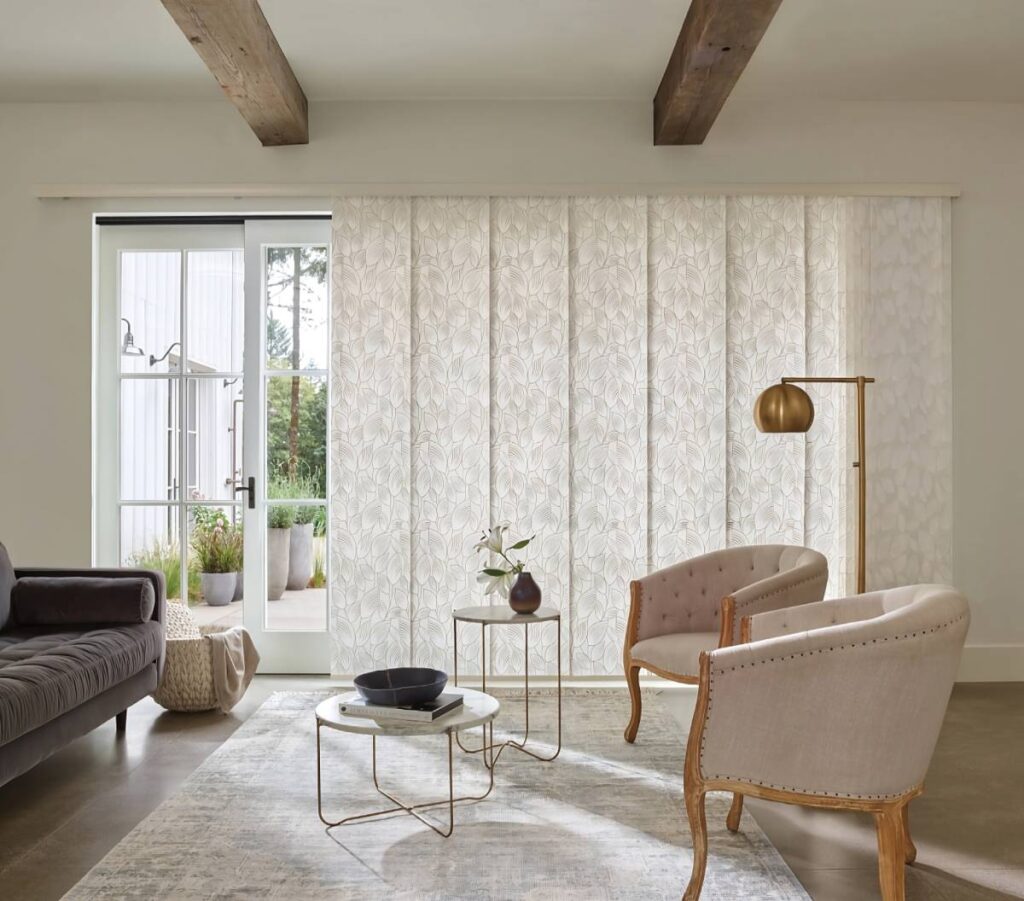 Patterned Hunter Douglas window treatments for sliding glass doors in a chic living room at Kerrville Window Fashionsnear Kerrville, TX