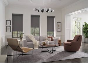 Stunning Hunter Douglas Designer Roller Shades on three windows in a chic living room at Kerrville Window Fashionsnear Kerrville, TX