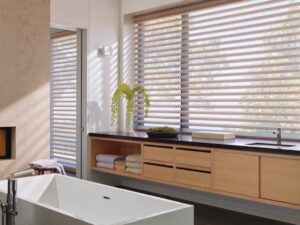 Hunter Douglas Pirouette® Sheer Shades on large windows in a chic and modern bathroom near Kerrville, TX